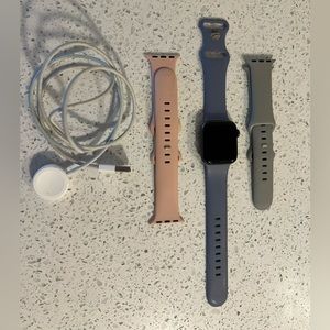 Apple Watch Series 4 with charger and extra bands